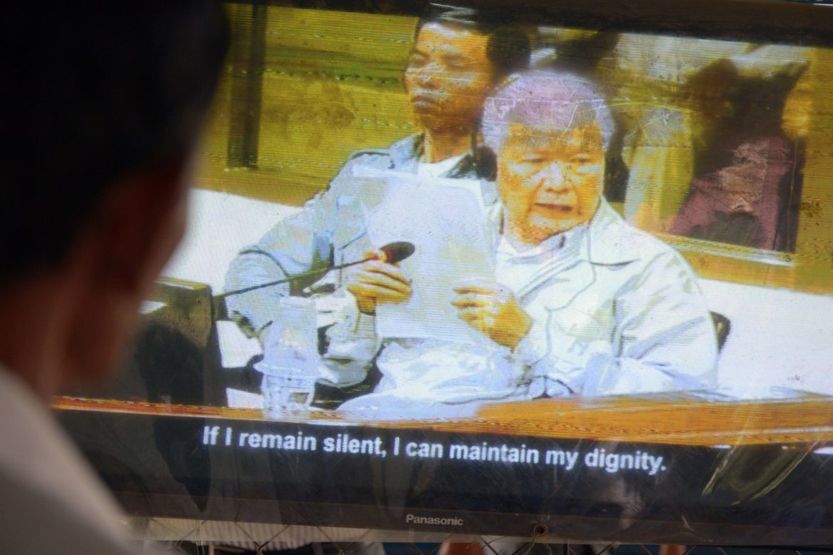  A Cambodian man Khieu Samphan on a television during the trial at the Extraordinary Chamber in the Courts of Cambodia (ECCC) in Phnom Penh on August 7. He and Nuon Chea were found guilty of crimes against humanity and sentenced to life in prison.