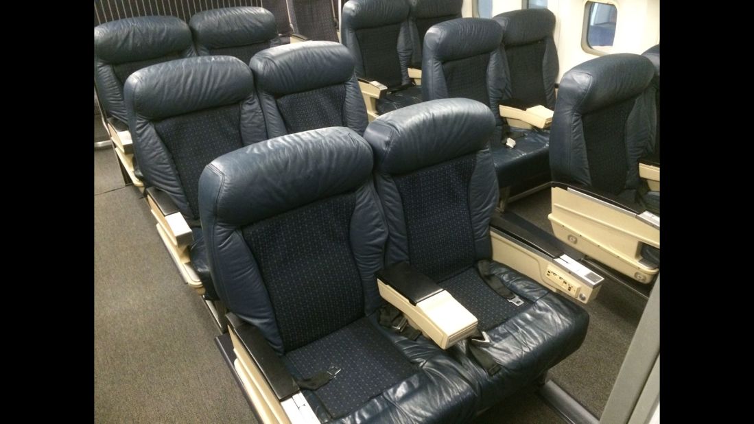 Aboard the "Spirit of Delta," visitors can walk through an airliner that's frozen in time, with old-style upholstery and armrests embedded with phones and audio controls. 