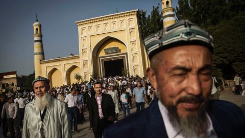 File: Uyghur men leave a mosque in Xinjiang Province, China on July 29, 2014. 