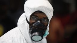 A Nigerian health official wears protective gear at the arrivals hall of Murtala Muhammed International Airport in Lagos, Nigeria, on August 6.