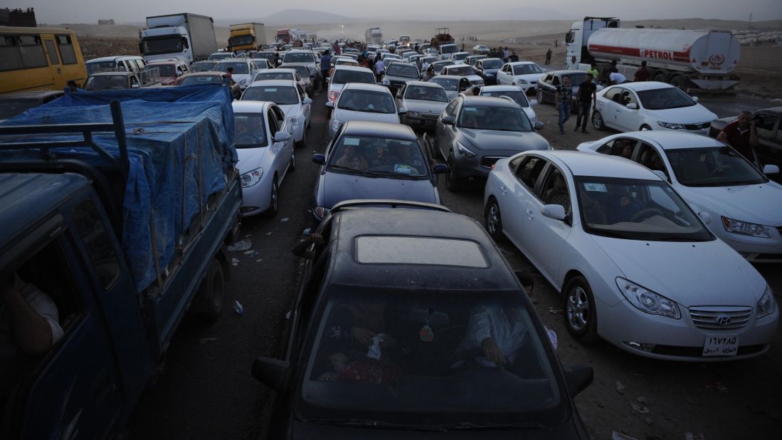 Thousands of Yazidi and Christian people flee Mosul on Wednesday, August 6, after the latest wave of ISIS advances.