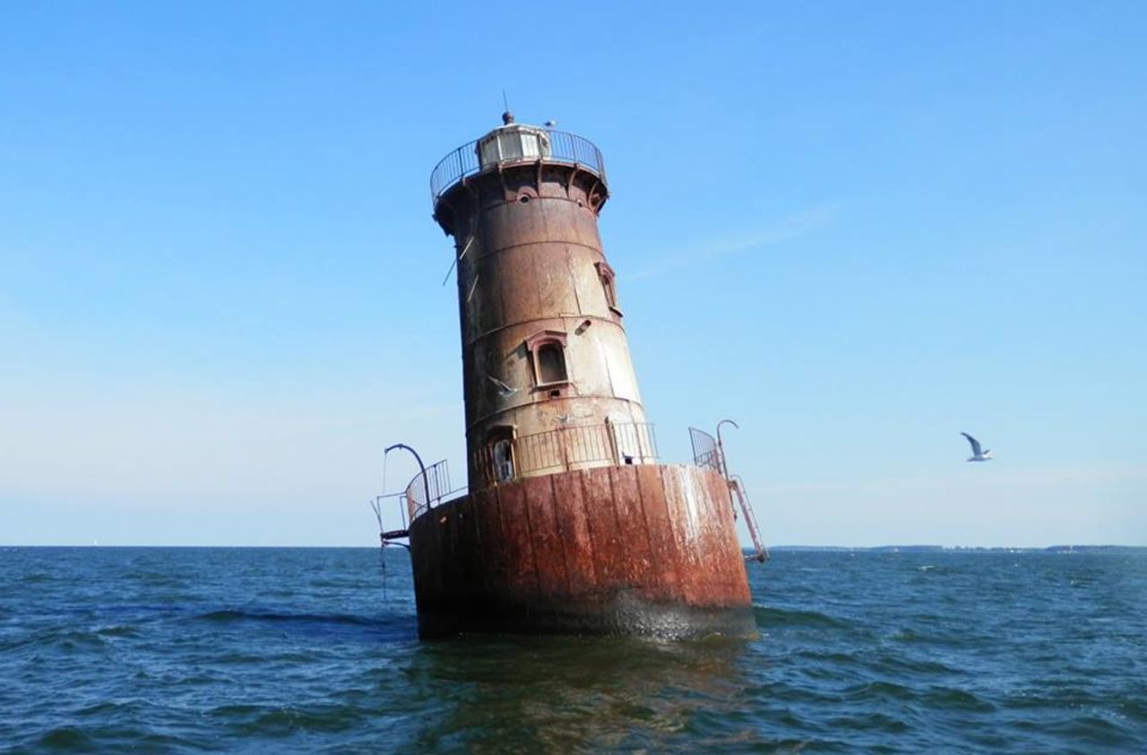 Sharps Island Light, located in Maryland's Chesapeake Bay, is only accessible by boat. In 1976, large ice floes <a href="http://tilghmanisland.com/lighthouse-tours/" target="_blank" target="_blank">tilted the tower 15 degrees</a>.<strong> Click the double arrows to see more photos.</strong><br />