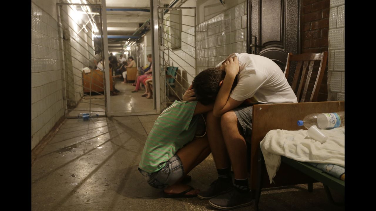 Residents of eastern Ukraine cry in a hospital basement being used as a bomb shelter August 7 in Donetsk.
