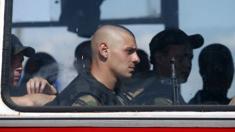 Ukrainian servicemen sit on a bus near Slovyansk, Ukraine, on Tuesday, August 5.