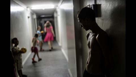 A boy stands in a hallway of a refugee hostel run by pro-Russian rebels in Donetsk on Monday, August 4.