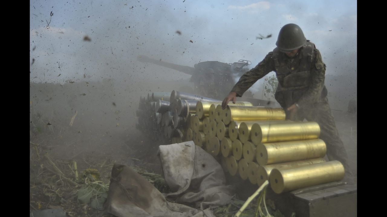Ukrainian soldiers fire shells toward rebel positions near Pervomaysk, Ukraine, on Saturday, August 2.