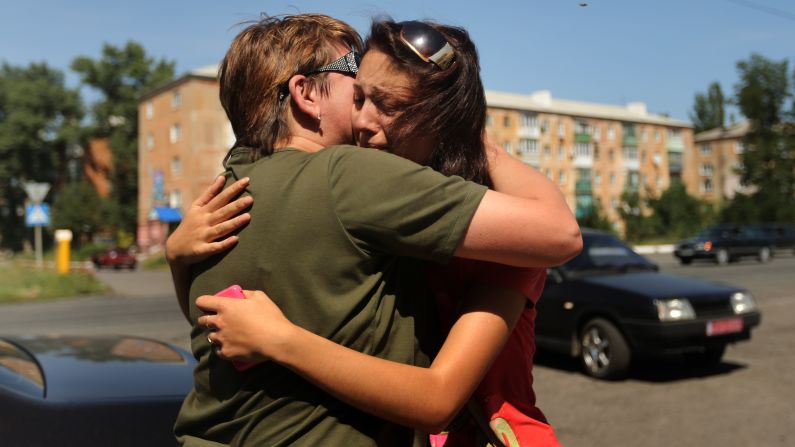 A woman says goodbye to her mother as she flees her home in Shakhtersk, Ukraine, on Tuesday, July 29. <a href="index.php?page=&url=http%3A%2F%2Fwww.cnn.com%2F2014%2F05%2F27%2Fworld%2Fgallery%2Fukraine-after-election%2Findex.html">See more photos of the crisis from earlier this year</a>