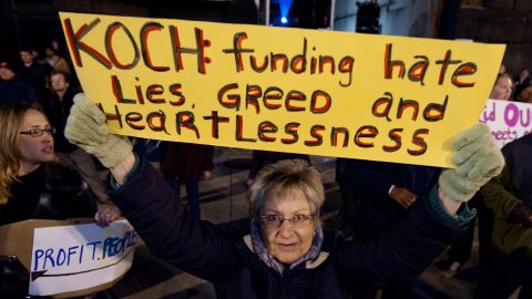 A woman protests against billionaire conservative donors Koch brothers in Washington in 2011.