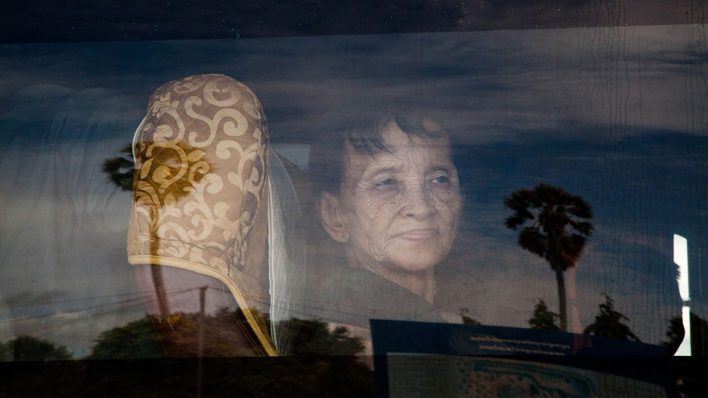 A Cambodian who survived <a href="http://www.cnn.com/2014/08/06/world/asia/cambodia-khmer-rouge-timeline/index.html">the Khmer Rouge's brutal rule</a> looks through a bus window on Thursday, August 7, after guilty verdicts were handed down to two of the regime's former leaders in Phnom Penh, Cambodia. Nuon Chea, otherwise known as Brother Number Two, and Khieu Samphan, the one-time President of Democratic Kampuchea, were sentenced to life in prison after being convicted of crimes against humanity. At least 1.7 million people -- nearly a quarter of Cambodia's population -- were killed by execution, disease, starvation and overwork under the Khmer Rouge's rule from 1975 to 1979.