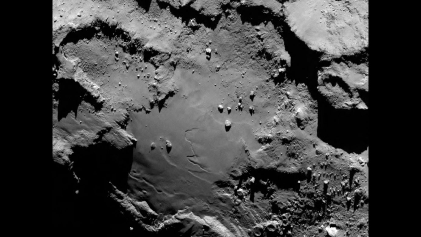 The European Space Agency's Rosetta spacecraft has become <a href="http://www.cnn.com/2014/01/17/tech/gallery/rosetta-the-comet-chaser/index.html">the first probe to orbit a comet</a> after arriving at its destination Wednesday, August 6. The spacecraft sent this image during its approach to comet 67P/Churyumov-Gerasimenko. From a distance of 130 kilometers (nearly 81 miles), it reveals detail of the smooth region on the comet's "body" section. 