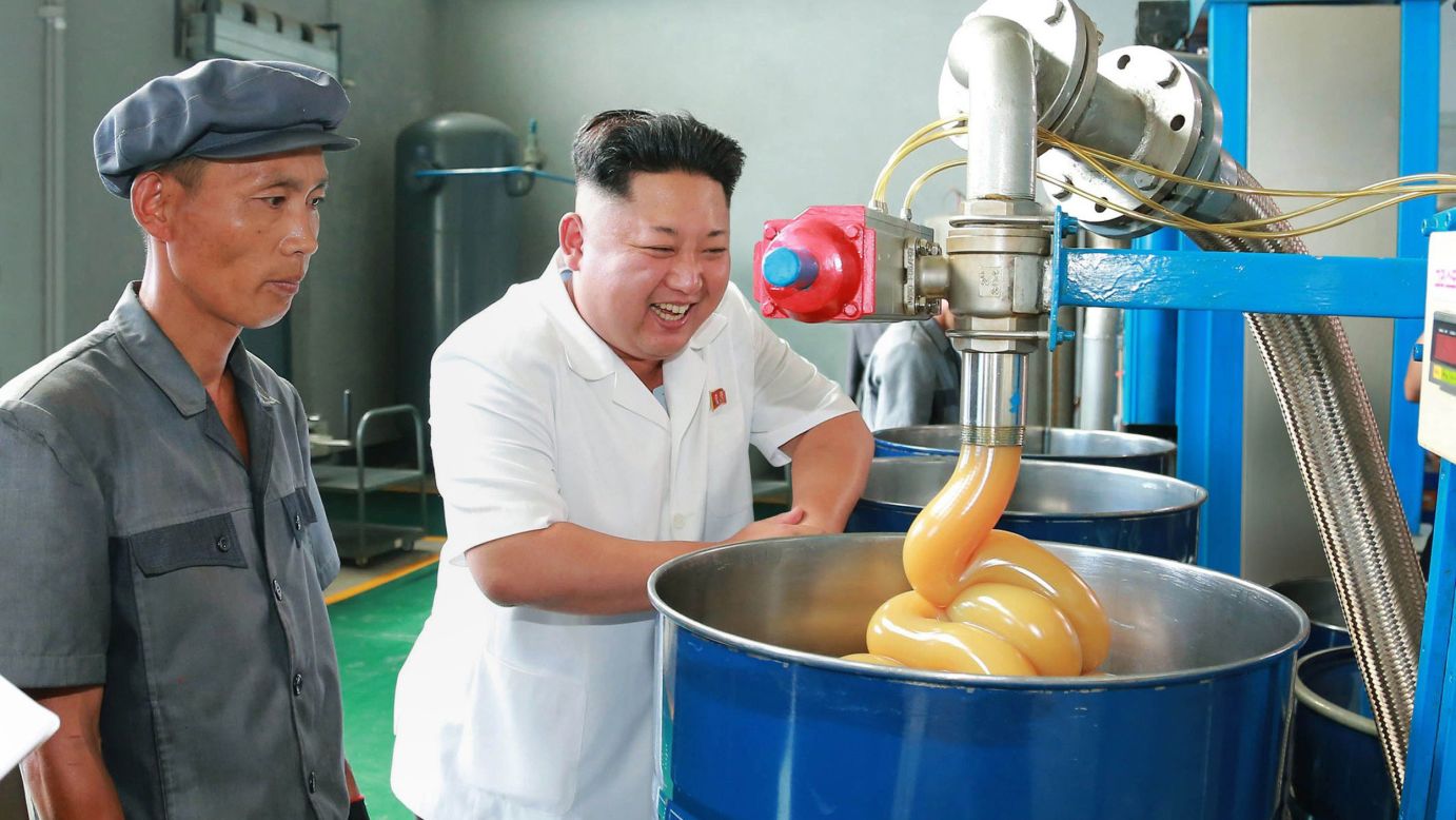 North Korean leader Kim Jong Un, right, inspects the Chonji Lubricant Factory in this undated picture released Tuesday, August 5, by North Korea's state-run news agency.