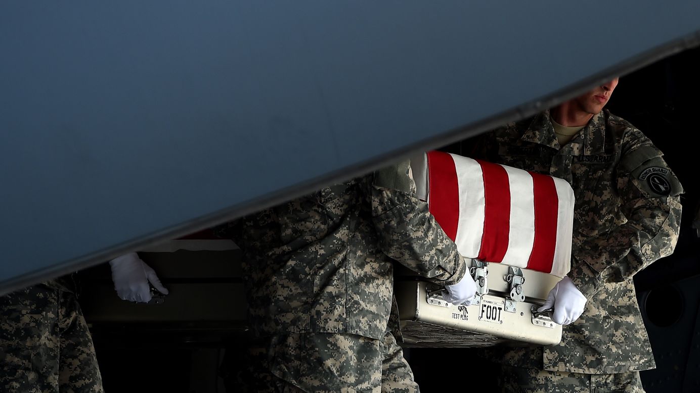 U.S. Army soldiers carry the flag-draped transfer case containing the remains of <a href="http://www.cnn.com/2014/08/05/us/afghanistan-general-greene/index.html">Army Maj. Gen. Harold J. Greene</a> during a dignified transfer Thursday, August 7, at Dover Air Force Base in Dover, Delaware. Greene, the most senior U.S. officer to be killed since 9/11, died when a gunman believed to be an Afghan soldier <a href="http://www.cnn.com/2014/08/05/world/asia/afghanistan-violence/index.html">opened fire at a training facility</a> in Kabul, Afghanistan, hitting the general and several others.