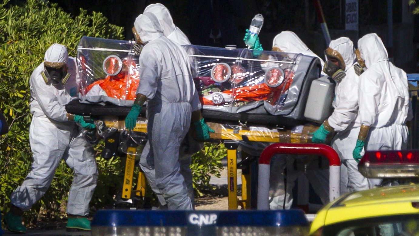 Paramedics wear protective suits as they move Miguel Pajares, a missionary infected with Ebola, to a hospital in Madrid for treatment on Thursday, August 7. Pajares contracted the disease in Liberia. Health officials say the current <a href="http://www.cnn.com/2014/04/04/world/gallery/ebola-in-west-africa/index.html">Ebola outbreak in West Africa</a> is the deadliest ever.