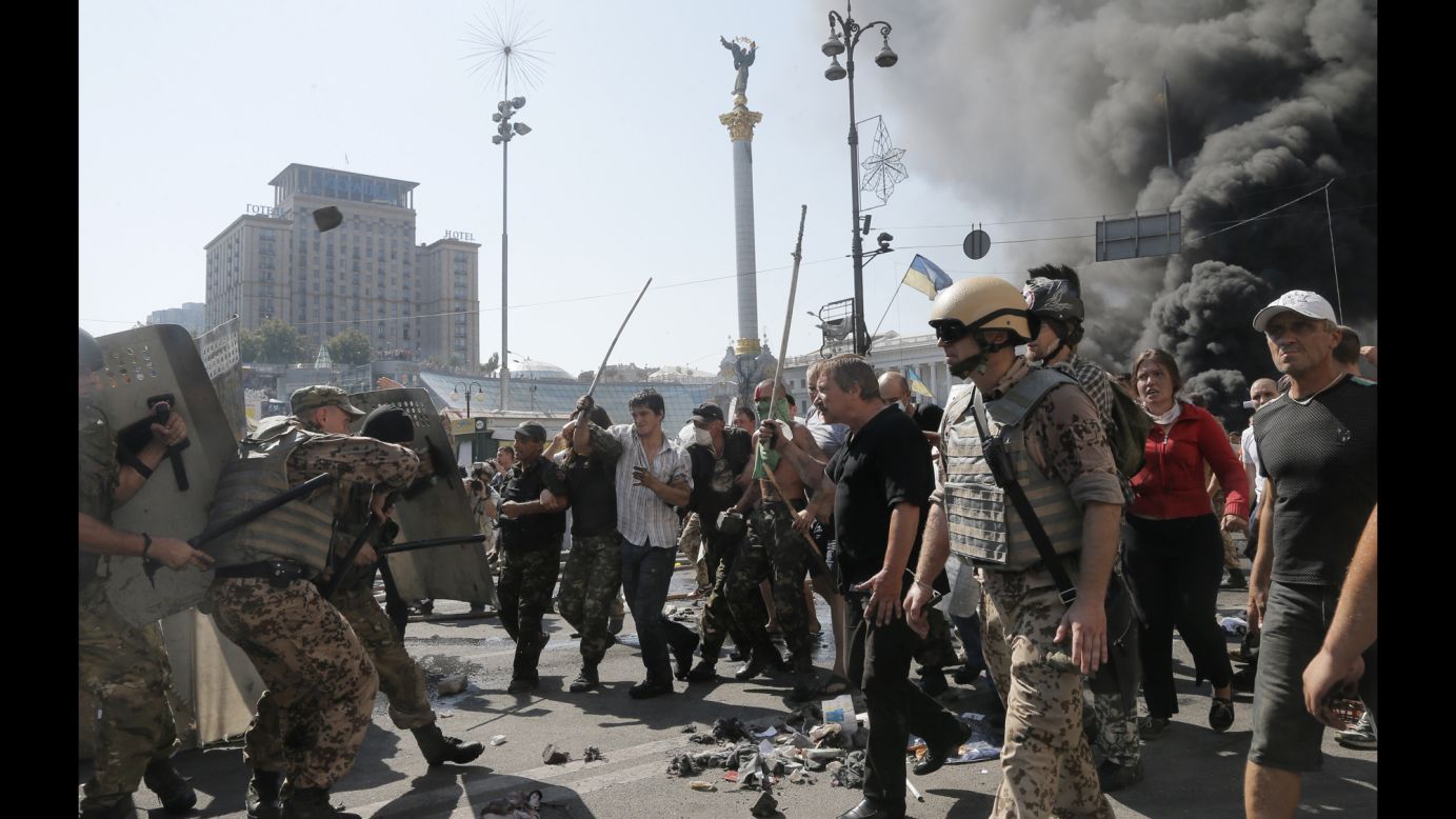Activists in Kiev, Ukraine, clash with a police battalion in Independence Square on Thursday, August 7. Demonstrators had confronted city workers who were attempting to clear the square.