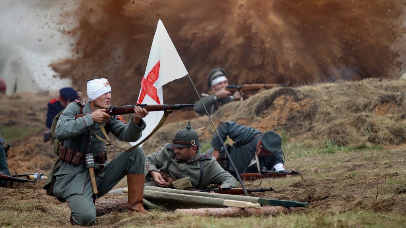 People dressed as German soldiers take part in a World War I re-enactment near the town of Smorgon, Belarus, on Friday, August 1.