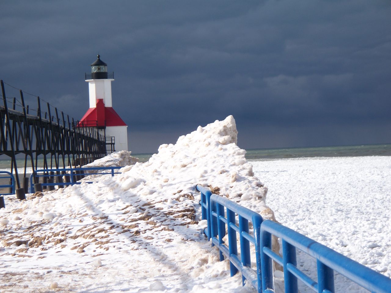 <a href="http://ireport.cnn.com/docs/DOC-1157394">Jenn Landreth</a> travels up to Lake Michigan once a year for the ice carving festivals and had to get a photo of this lighthouse in St. Joseph, Michigan. She loves the contrast here of the lighthouse in the snow. "It's funny, people tell me how beautiful these lighthouses are in the summer, and I have yet to make it up there when there isn't snow."