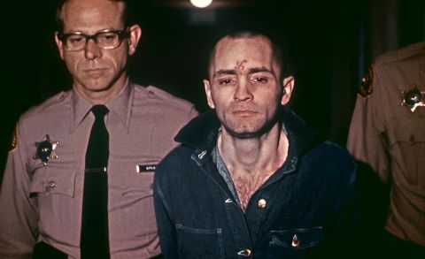 Manson, head shaved and beardless, is led his sentencing hearing on March 29, 1971. He received the death penalty as well.