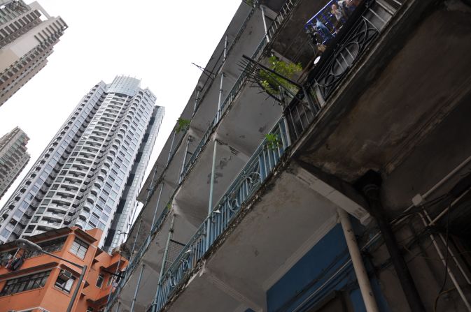 The Blue House, which has architecturally significant balconies, is just a few blocks from fancy new highrises that have sprung up in Hong Kong over the last two decades.