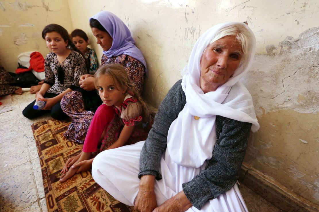 Fleeing Yazidi families take shelter at a school in Dohuk in Iraq's Kuristan region.