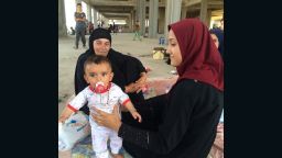 Six-month old Kathem, 1 of more than 10,000 Iraqis who fled ISIS to Erbil, taking shelter in an unfinished building on August 7, 2014.