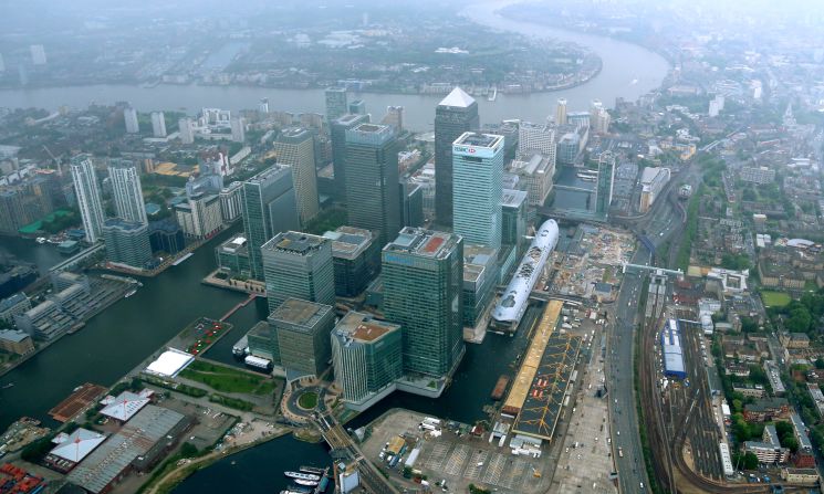 In the late 1980s the site was redeveloped, including financial sector Canary Wharf (pictured). "When the Docklands first opened, they were a closed working space," said Georgina Young, senior curator at the Museum of London. "So this also represents an opening up of the area, with more of a focus on wealth and luxury."