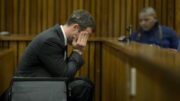 Oscar Pistorius sits in the dock during closing arguments in his murder trial in the Pretoria High Court on August 8, 2014, in Pretoria, South Africa.