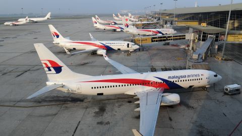 (FILES) This file photo taken on March 30, 2014 shows Malaysia Airlines planes parked at the terminal at Kuala Lumpur Intenational Airport (KLIA) in Sepang. Deeply troubled Malaysia Airlines will be de-listed and taken private ahead of a major restructuring following the twin disasters of MH370 and MH17, under a proposal announced on August 8, 2014 by its majority shareholder. AFP PHOTO / FILES / ROSLAN RAHMANROSLAN RAHMAN/AFP/Getty Images