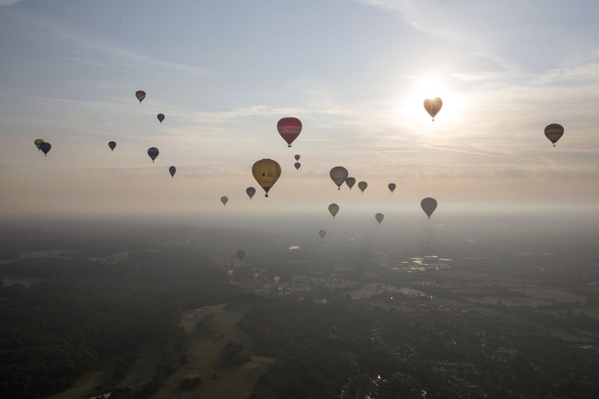 AUGUST 8 - BRISTOL, ENGLAND: Hot air balloons depart from Aston Court on the first full day of the Bristol International Balloon Fiesta. Now in its 36th year, the four-day fiesta is Europe's largest annual hot air balloon event and <a href="http://www.bristolballoonfiesta.co.uk/content/8/about-us.aspx" target="_blank" target="_blank">attracts more than 100 hot air balloons and 500,000 visitors.</a>