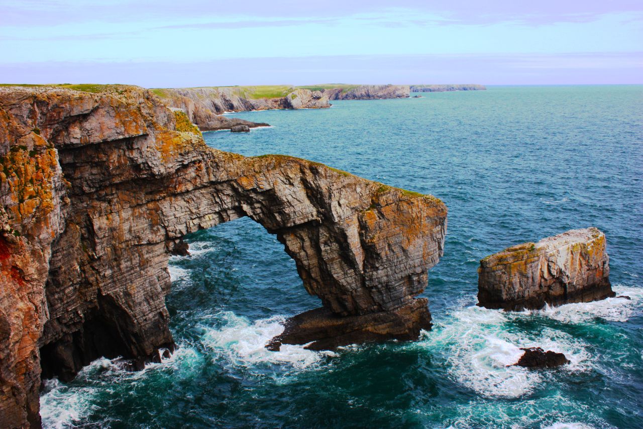 <a href="http://www.pembrokeshirecoast.org.uk/default.asp?pid=120" target="_blank" target="_blank">The Green Bridge of Wales</a> on the rocky Pembrokeshire coastline is one of the most famous spots in Wales. 