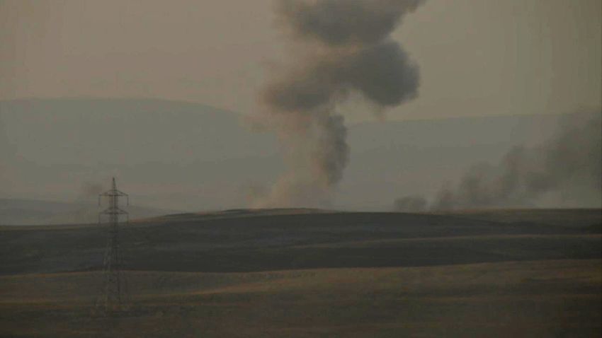 This image made from AP video shows smoke rising from airstrikes targeting Islamic State militants near the Khazer checkpoint outside of the city of Irbil in northern Iraq, Friday, Aug. 8, 2014. The Iraqi Air Force has been carrying out strikes against the militants, and for the first time on Friday, U.S. war planes have directly targeted the extremist Islamic State group, which controls large areas of Syria and Iraq.(AP Photo via AP video)
