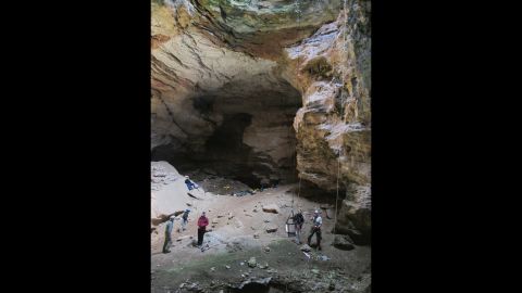 Images taken in July from the Bureau of Land Management show researchers inside the Natural Trap Cave in north-central Wyoming, which contains the remains of tens of thousands of animals.