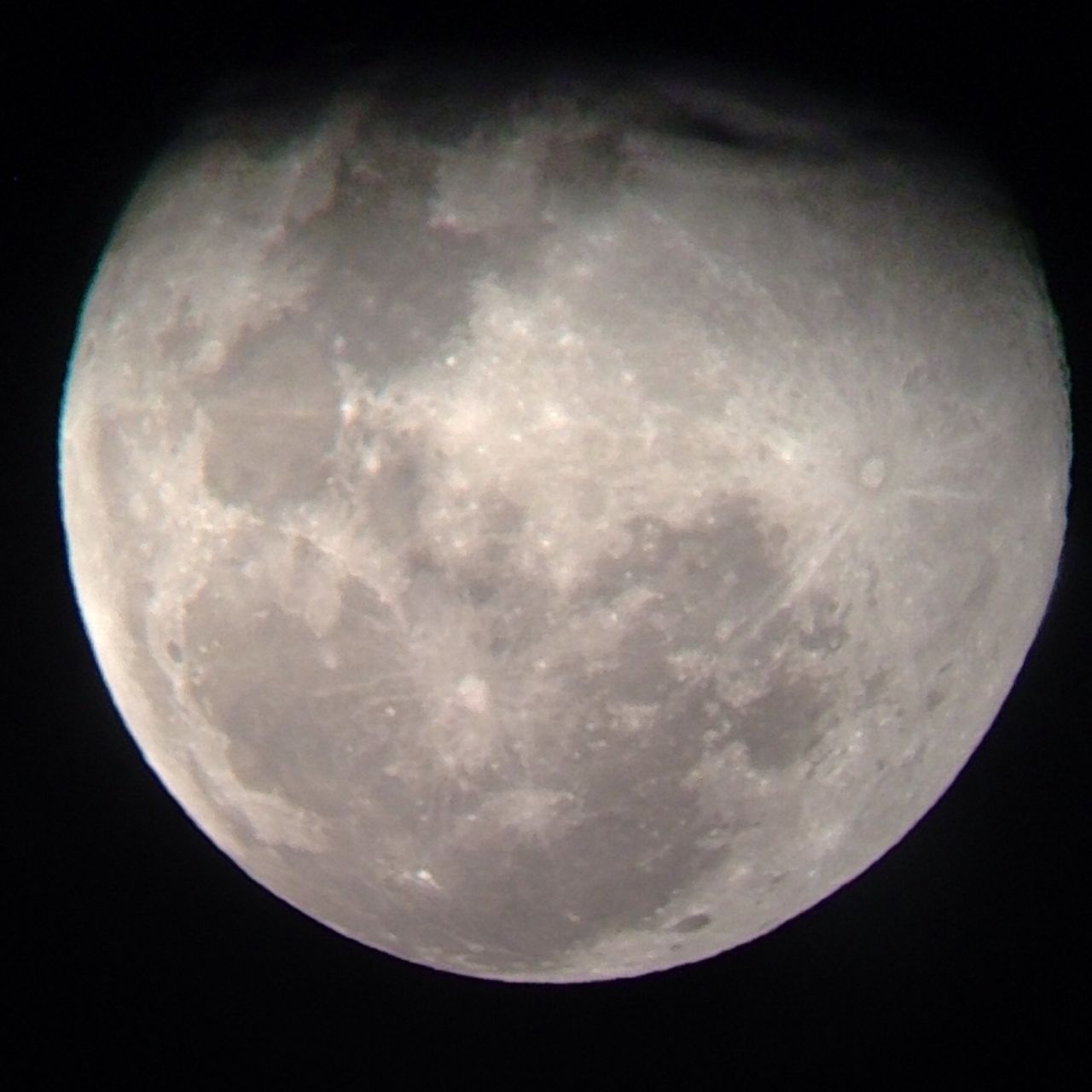 <a href="http://ireport.cnn.com/docs/DOC-1159790">Eric Strauss </a>of Clifton, Virginia, shot this photo through the viewfinder of his neighbor's telescope. "This is the first time I had ever tried that, and it worked out better than I would have ever imagined," he said. "The hardest part was to focus and frame the moon in the viewfinder correctly. The shadow on the top of the picture is not the moon's shadow, but instead from the way I framed the image within the viewfinder."