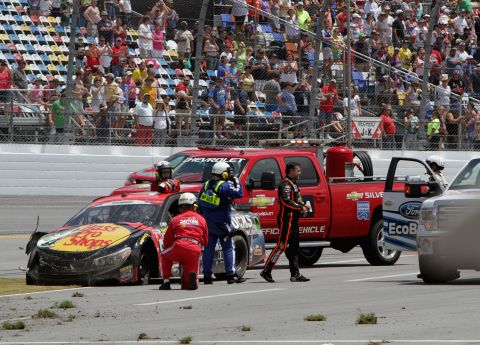 Stewart gets out of his car after a crash in Daytona Beach, Florida, in July 2014.