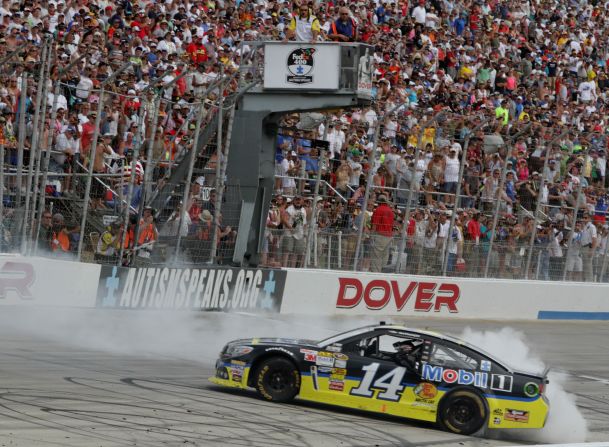 Stewart celebrates with a burnout after winning a race in Dover, Delaware, in June 2013.