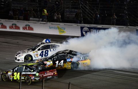 Stewart, in car No. 14, spins out after a wreck in Richmond, Virginia, in April 2013.