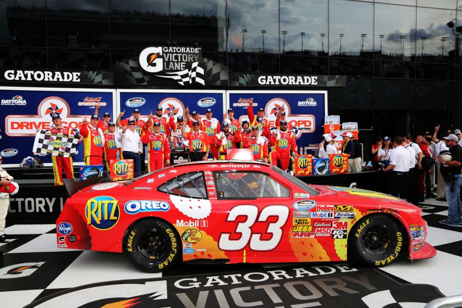 Stewart poses after winning a race in Daytona in February 2013.