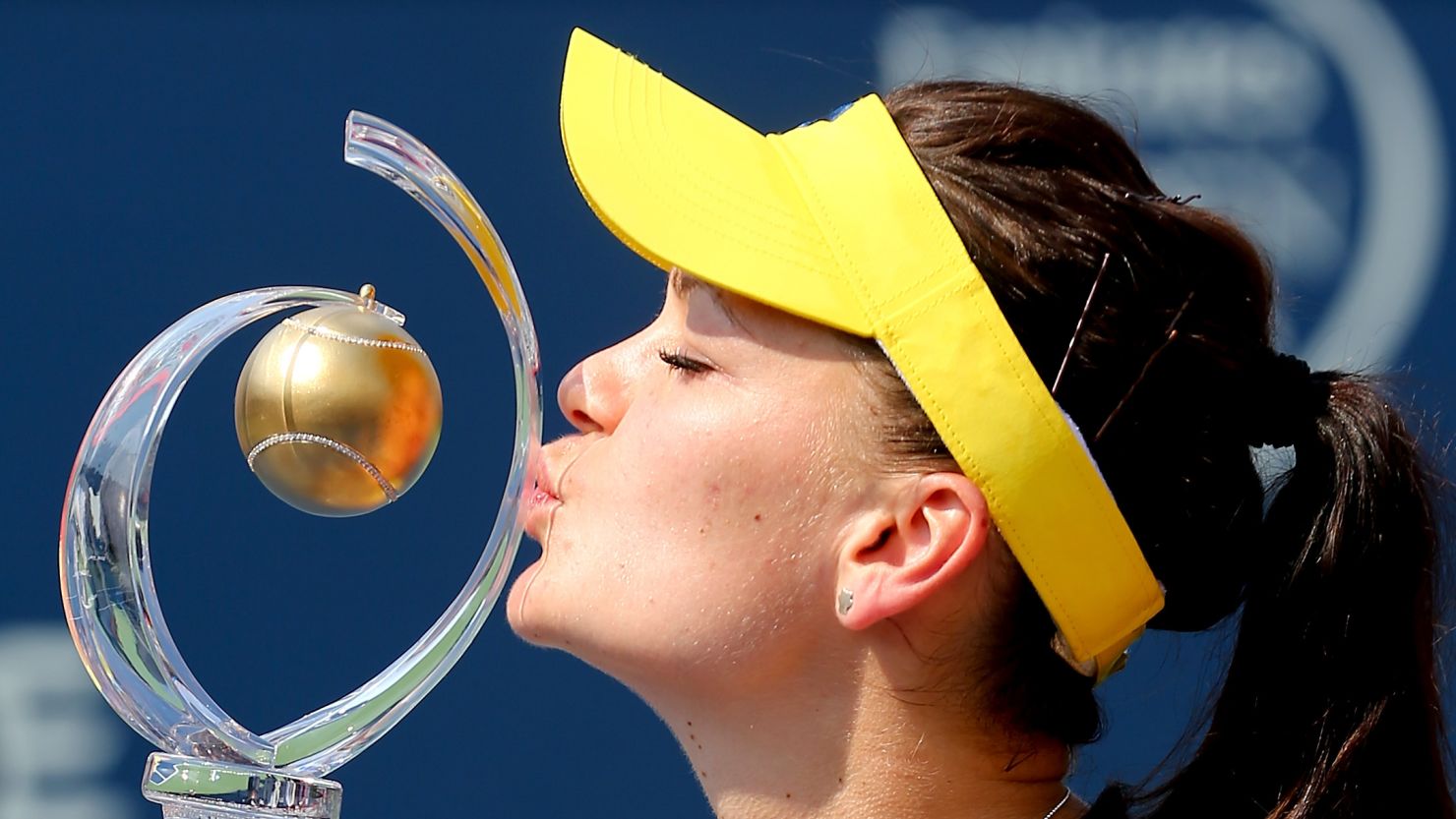 Agnieszka Radwanska kisses the trophy after beating Venus Williams to win the Rogers Cup in Montreal.