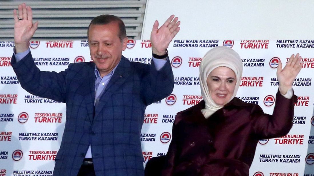 Turkish President-elect Recep Tayyip Erdogan and his wife, Emnine, cheer their supporters after the results of elections at the headquarters of Turkey's ruling Justice and Development Party (AKP) in Ankara on Sunday, August 10. Erdogan will become the country's first directly elected president by a wide margin of votes, according the semi-official Anadolu News Agency.