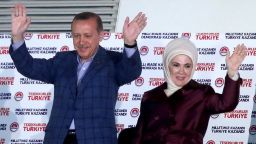 Turkish president elect Recep Tayyip Erdogan and his wife Emnine cheer their supporters after the results of the elections at the headquarter of Turkey's Ruling Party Justce and Developmant Party (AKP) in Ankara, Turkey, on Sunday, August 10.   Erdogan will become the country's first directly-elected president by a wide margin of votes, according the semi-official Anadolu News Agency.