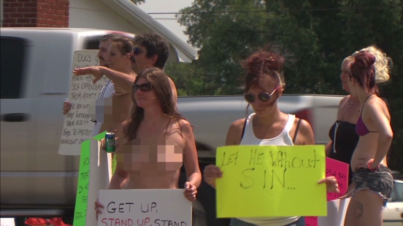 Exotic dancers protest topless at church