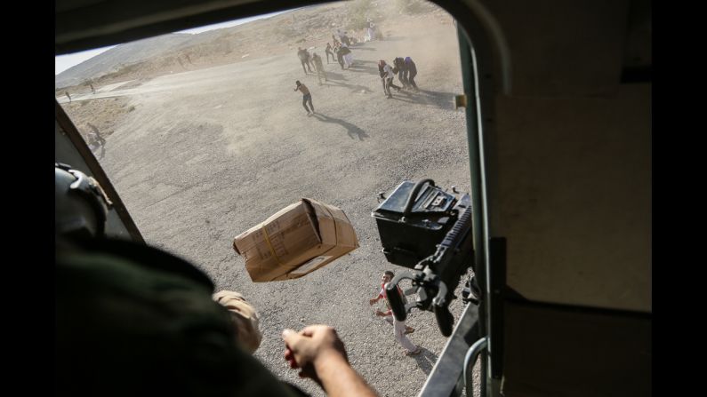 A CNN crew was on the flight, which took diapers, milk, water and food to the site. Thousands of people have been fleeing from the militant group ISIS, which has <a href="http://www.cnn.com/2014/06/13/world/gallery/iraq-under-siege/index.html">taken over large swaths of northern and western Iraq</a> as it seeks to create an Islamic caliphate that stretches from Syria into Iraq.