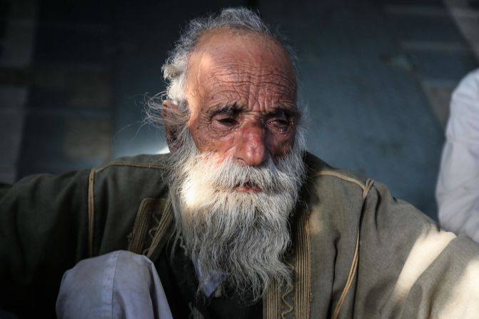  An elderly Yazidi man cries after he was rescued.
