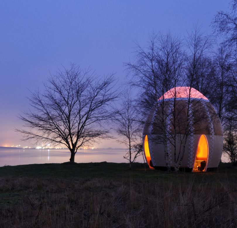 <em>Fire Shelter: 01, Denmark</em><br /><br />Looking like an Easter egg crossed with a tepee, Fire Shelter is designed to send the warm glow of its central fire out into the landscape and welcome in members of the public who might be wandering in this former landfill site outside Copenhagen. <br /><br />It is a personal project of architect <a href="http://shjworks.dk/projects/2013/1/21/fire-shelter01-2013.html" target="_blank" target="_blank">Simon Hjermind Jensen</a> who has said it takes its inspiration from the "architecture of ethnic and nomadic people." He describes it as a "gift" for those who wish to use it and adds: "It´s about being in the company of good friends, in a fantastic place, around a fire during the dark time of the year."<br />