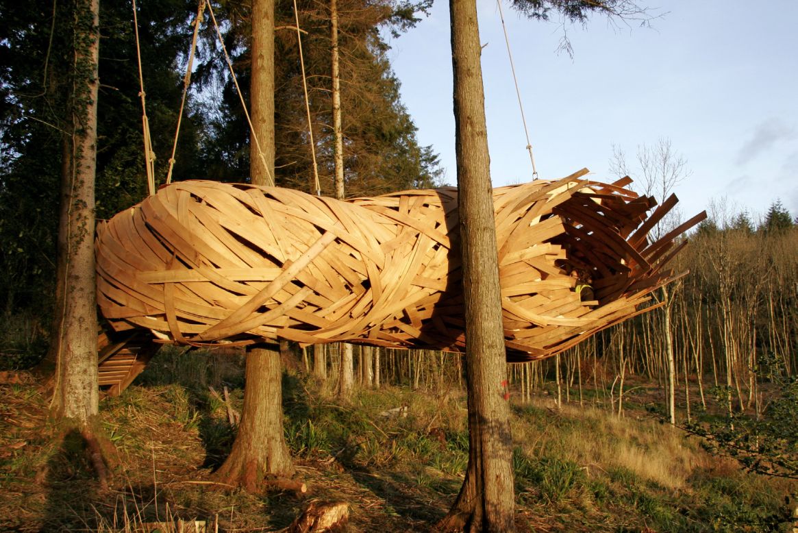 <em>Cocoon, United Kingdom</em><br /><br />This inhabitable cocoon has literally been woven into the landscape, using cedar strips. It is a monocoque structure, meaning that its load is supported by the skin, working in much the same way as an egg shell.<br /><br />The site-specific hideout, by <a href="http://designandmake.aaschool.ac.uk/)" target="_blank" target="_blank">AA Design & Make</a>, sits at the edge of a forest clearing in Hook Park, South West England, and is designed with the aim of visitors closer to the trees and giving them a great spot to watch the sunset.