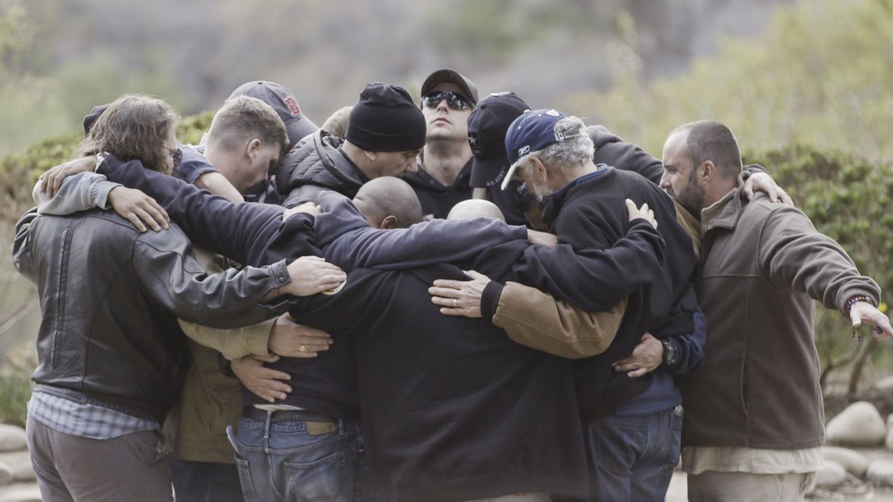 A Save a Warrior class forms a support circle.