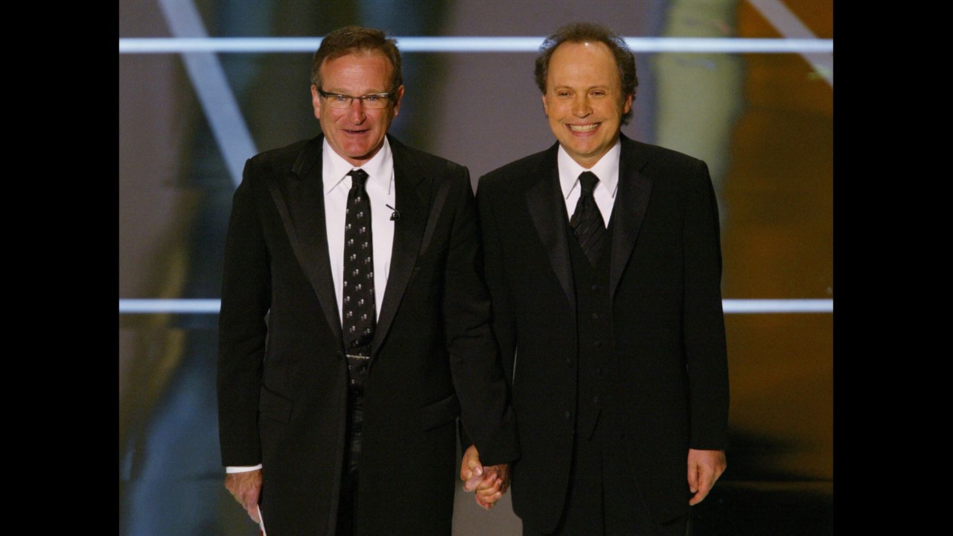Williams and Oscar host Billy Crystal perform at the 76th Academy Awards show in 2004. 
