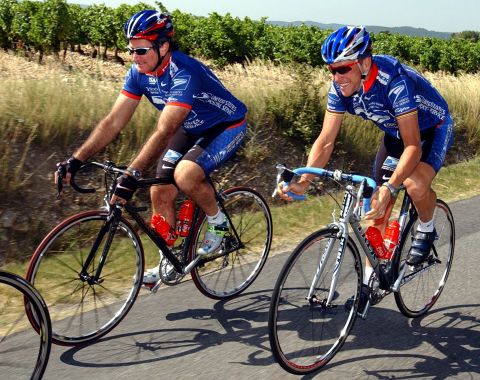 U.S. Postal Service team rider Lance Armstrong rides with Williams during training on a rest day of the 89th Tour de France cycling race in Vaison La Romaine on July 22, 2002.