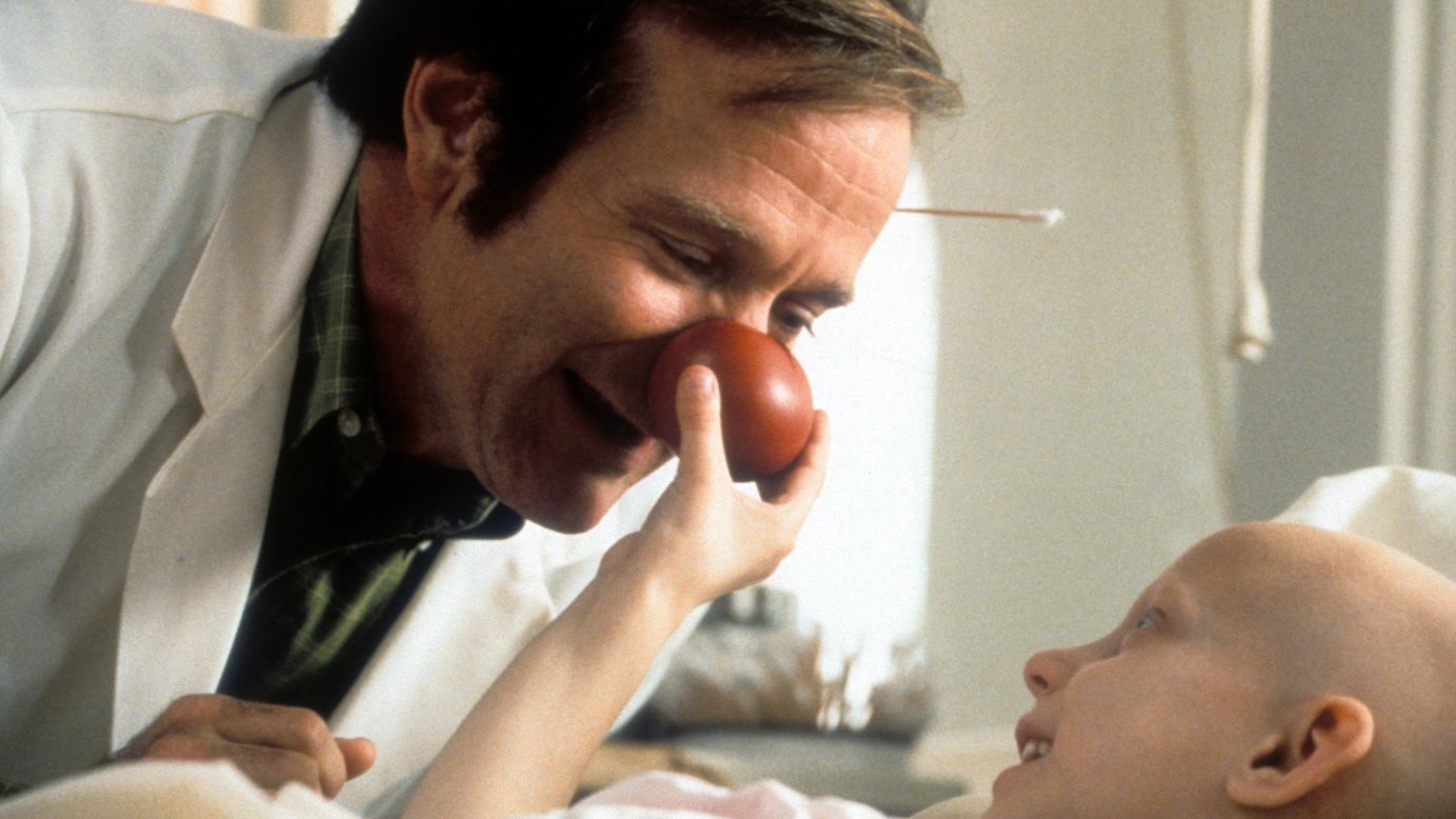 Williams visits a sick child in a scene from the film "Patch Adams" in 1998.