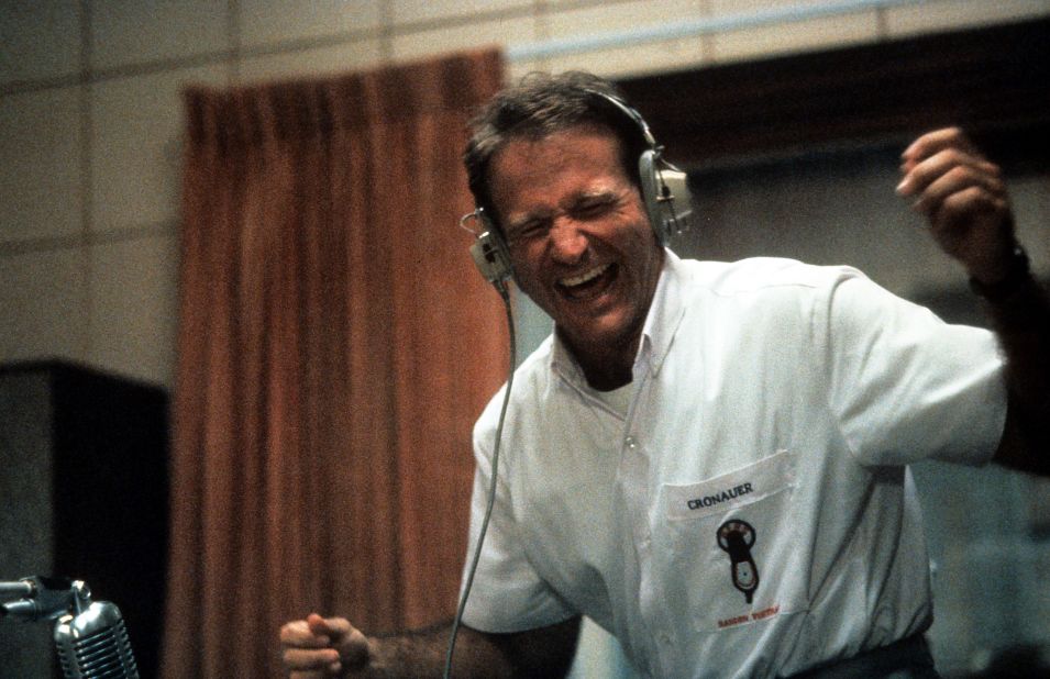 Williams enjoys music through a headset in a scene from the film "Good Morning, Vietnam" in 1987.