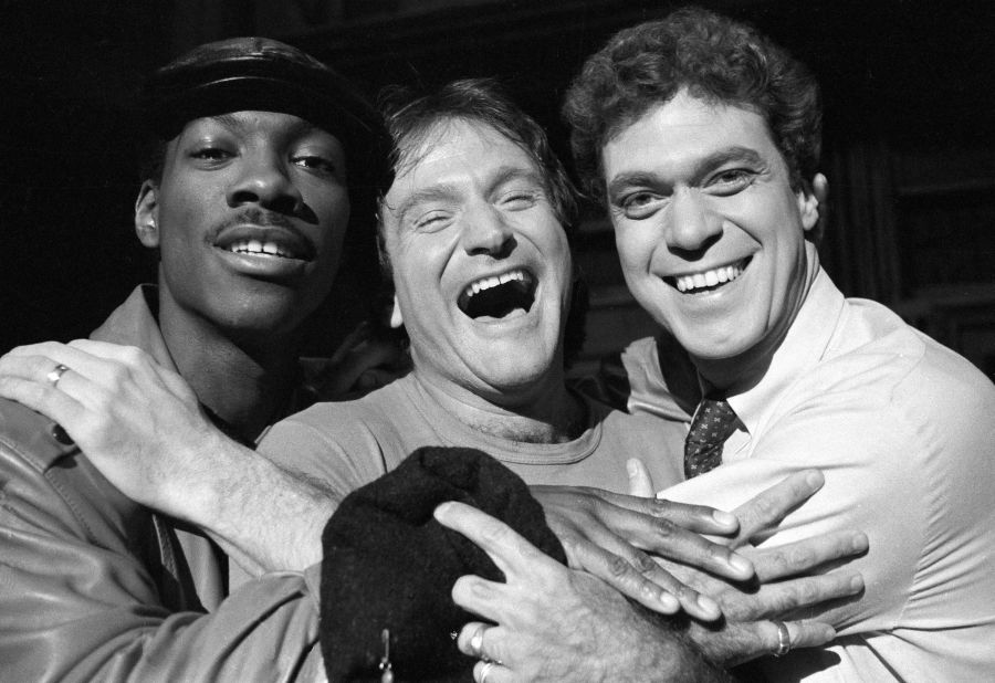 Williams, center, takes time out from rehearsal at NBC's "Saturday Night Live" with cast members Eddie Murphy, left, and Joe Piscopo on February 10, 1984. Williams would appear as guest host on the show.
